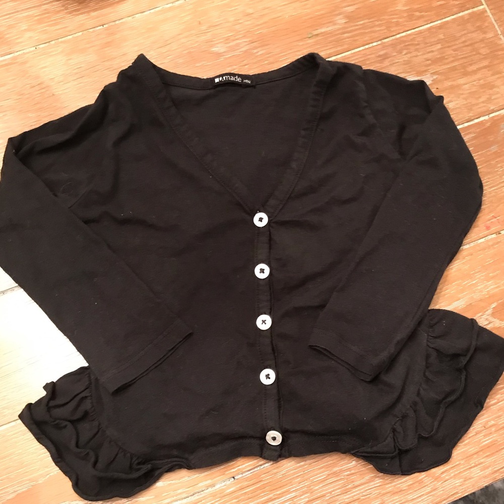 La made black cardigan with ruffle detail